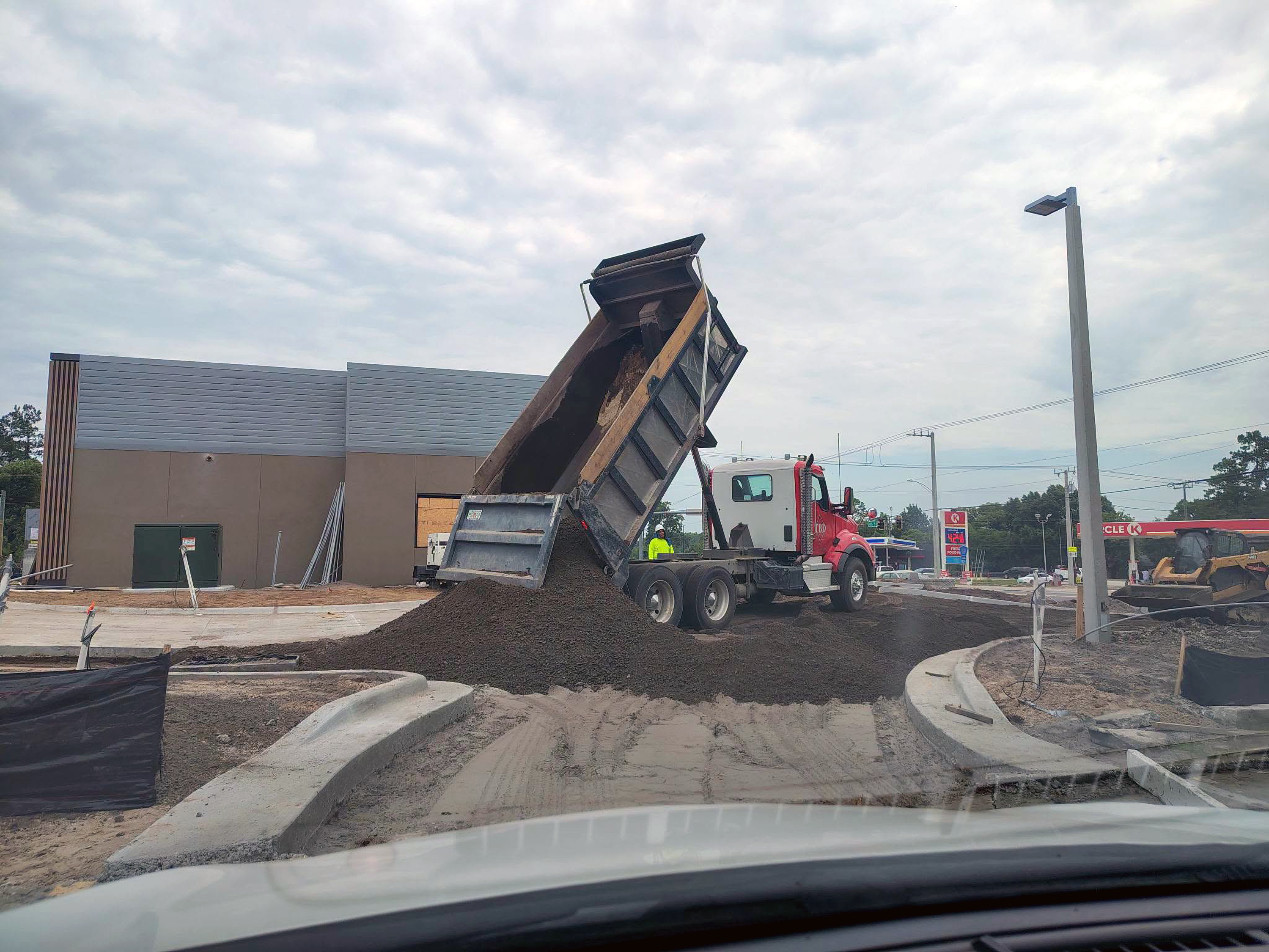 A truckload of dirt is delivered to shape the parking lot at Hilliard’s new McDonald’s. Triple B Dirt LLC hauled 65 loads of dirt then topped it with 40 loads of crushcrete road base to help form the parking lot. Photo courtesy of Triple B Dirt, LLC