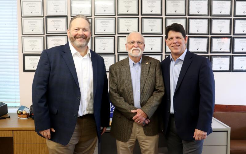 New Southeast Region Publisher Todd WIlson and retiring Coastal Region Publisher Foy Maloy join Community Newspapers, Inc. President Mark Major Dec. 17.