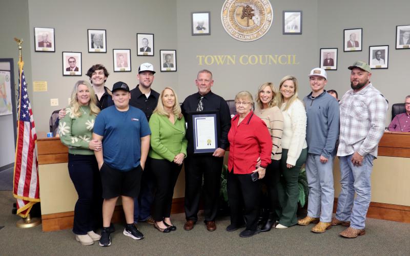 Hilliard Town Council President Kenny Sims receives a resolution recognizing his 20 years as a public servant.