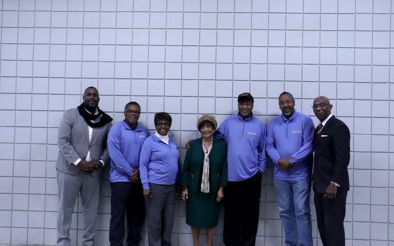 The Rev. Marva Mitchell, the Rev. Kenyon Thompson, the Rev. Terence Sapp, the Rev. Tyrone Blue, the Rev. Bryon Ramseur, the Rev. Walter Cooper Jr., and the Rev. Betty Williams stand together at the community fellowship.