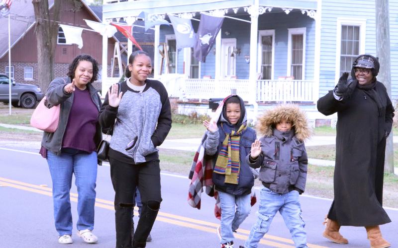 Jennifer Albertie, Kristen Thomas, Olivia Watson and Liam and Milton Mohead walk together during the Dr. Martin Luther King, Jr. Day parade Jan. 20 in Hilliard. 