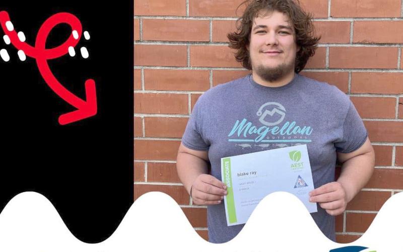 Blake Ray holds his certification.
