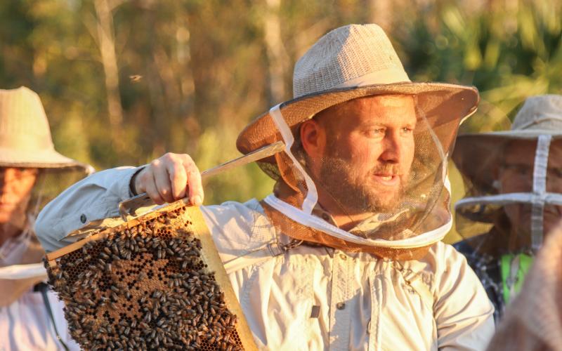 Myron Beachy, president of Nassau County Beekeepers Association, teaches attendees about honeybees at a mentoring session Feb. 27 at the Northeast Florida Fairgrounds. The association focuses on educating the public about honeybees. Photo by Ashley Chandler