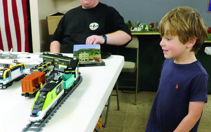 Hunter Tucker, 4, eyes a model train during the 2024 Railroad Day Festival. Plenty of activities await local families at the event Saturday. Visit www.fb.com/wnhsfl.org to learn more.