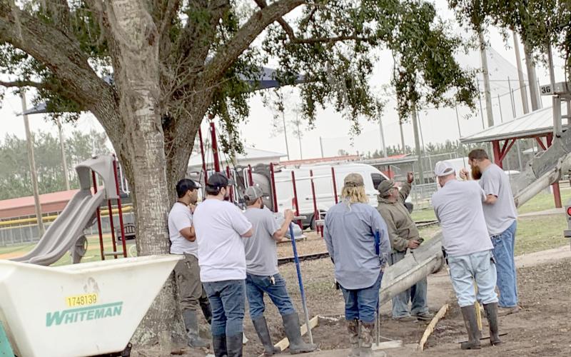Nassau County Facilities Maintenance staff prepare to spread concrete for a sidewalk at the Stein-Tompkins Sports Complex in Hilliard.