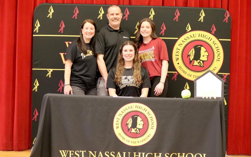 Makenna Cripps, seated, will play softball at Florida Gateway College.