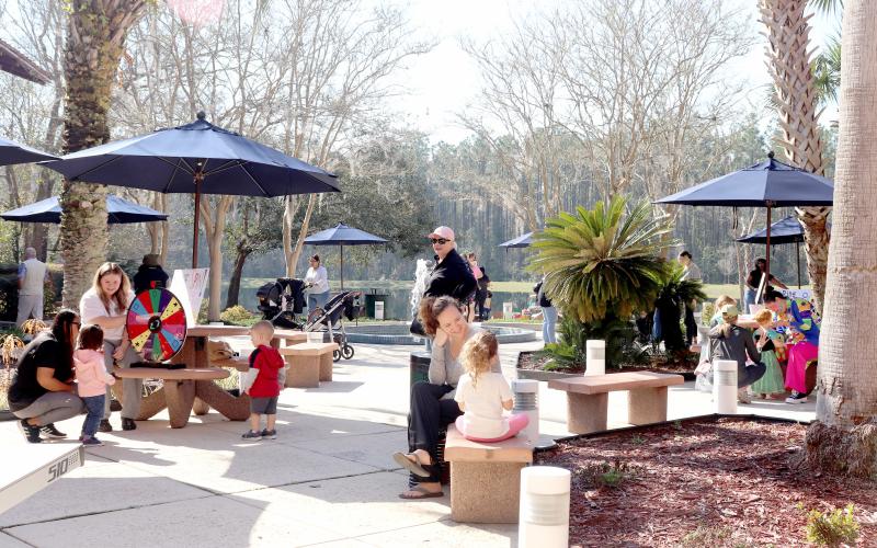 Families play games at the mini carnival.