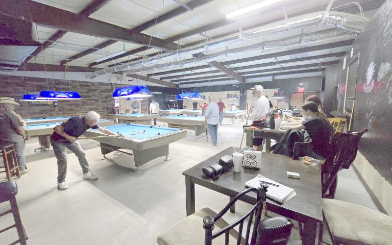 Locals enjoy playing pool at Top Hat Billiards, which may relocate to an adjacent property. Submitted