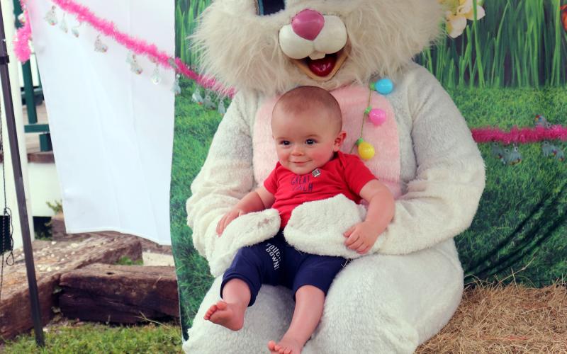 Teagan Ryals, 7 months, visits the Easter Bunny for the first time during the festival.