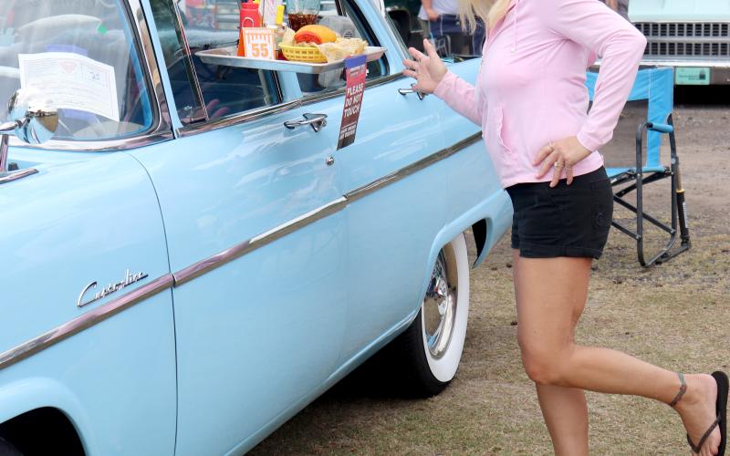 Veronica Dykes of Jacksonville poses with a 1955 Ford Customline.