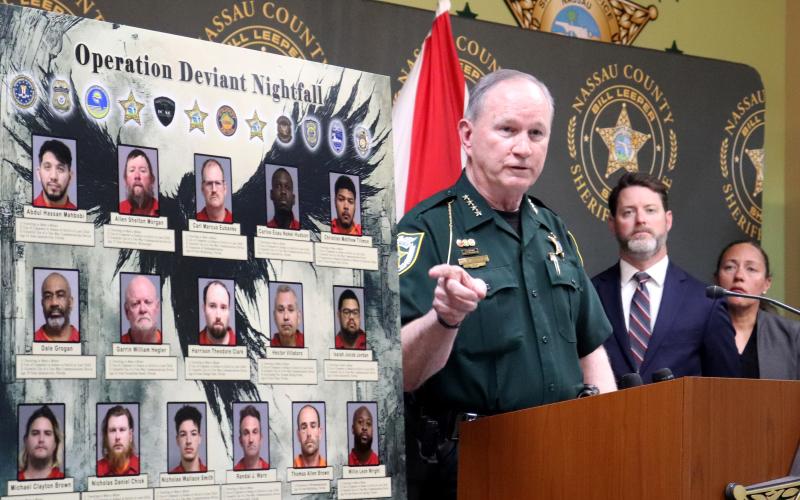 Nassau County Sheriff Bill Leeper points to a board displaying those arrested during Operation Deviant Nightfall. He held a press conference. Photo by Anna Newhoff