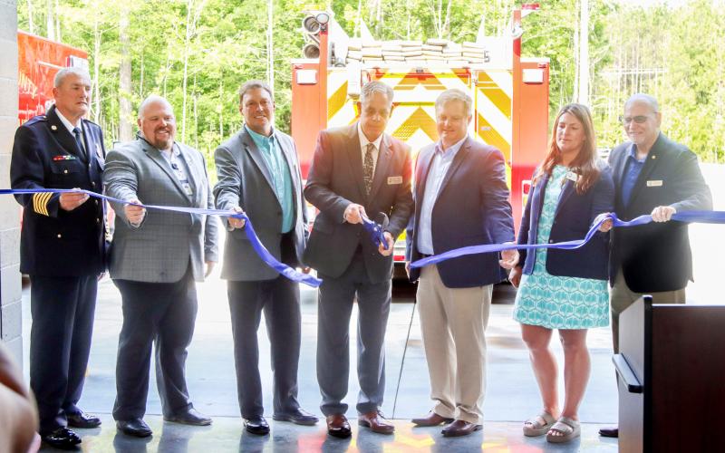 County leaders cut the ceremonial ribbon May 7 to open Nassau County Fire Rescue Station 10 in Yulee. From left, NCFR Chief Brady Rigdon, county commissioners Klynt Farmer, Jeff Gray, A.M. “Hupp” Huppmann, GreenPointe Holdings, LLC President Mike Taylor and county commissioners Alyson McCullough and John Martin. Photo by Ashley Chandler