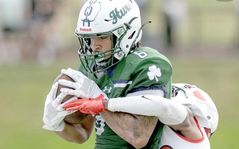 Chaz Davis carries the ball for Mercyhurst University against Frostburg State University Sept. 28. Frostburg won 25-24. Davis, a Callahan native, enters his final season of collegiate football this year. He catches the ball for a touchdown during homecoming against Buffalo State University Oct. 5. The Lakers shut out the Bengals 55-0.