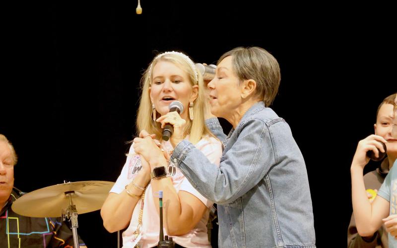 Callahan Intermediate School Principal Kerri Boatright sings with Bonnie Eisele during the drum clinic. Photo by Anna Newhoff