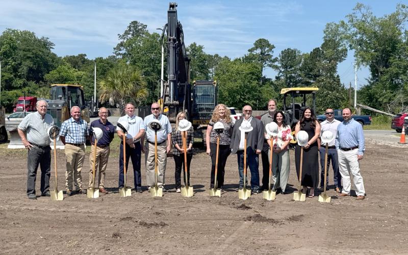 George Knabb, Sr., Mike Stokes, Bill Hagan, Mike Griffis, Lance McCubbin, Deanna Dinkins, Angela Drury, Callahan Mayor Randy Knagge, Joel Barber, Rebecca Rounsville, Marah Davis, James Owens and Wade Johnson celebrate the groundbreaking of the new state-of-the-art TRU-FI Credit Union branch in Callahan May 20. Submitted