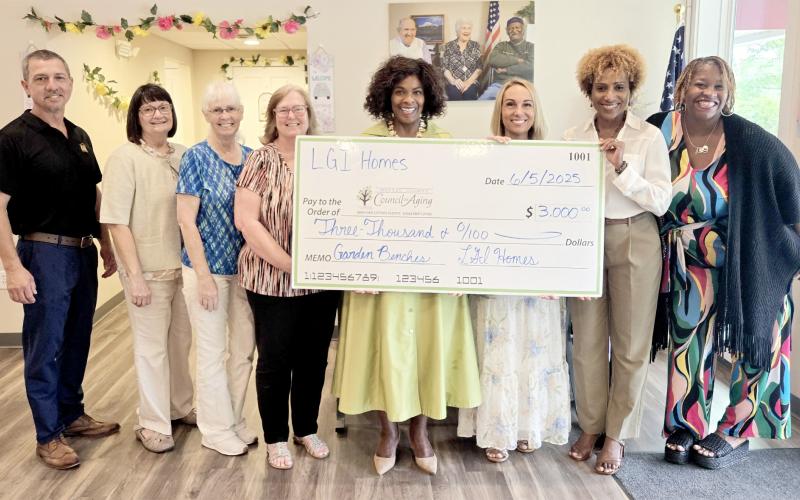 LGI Homes recently donated $3,000 to the Nassau County on Council on Aging to support building benches at the Westside Senior Life Center in Hilliard. NCCOA President and CEO Janice Ancrum and staff accept the donation.