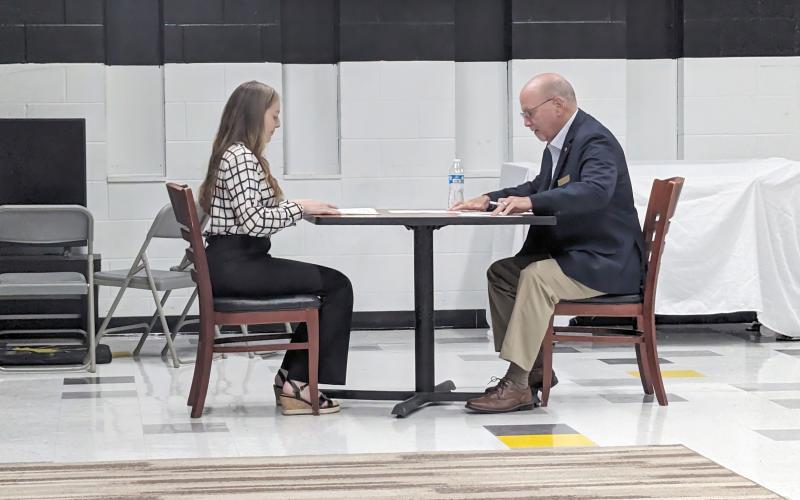 Nassau County Commissioner John Martin interviews a student during “The Great Shake off” at Sonshine Christian Academy. The panel of interviewers included, from left, Martin, Pastor Marty Paparo, Pastor Jeul Strickland, Nassau County Commissioner Klynt Farmer and Ken Griffin. Submitted