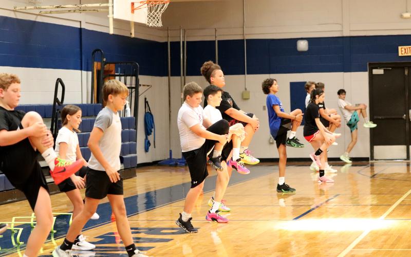 Campers warm up at the start of camp.