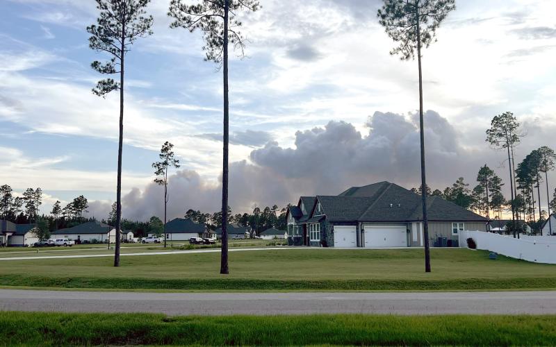 Smoke from the Rowe Road Fire billows into the sky Friday evening in Hilliard. The fire grew to 128 acres and its cause is under investigation. Photo courtesy of Darryl and Tamara Cawley-Del Rio