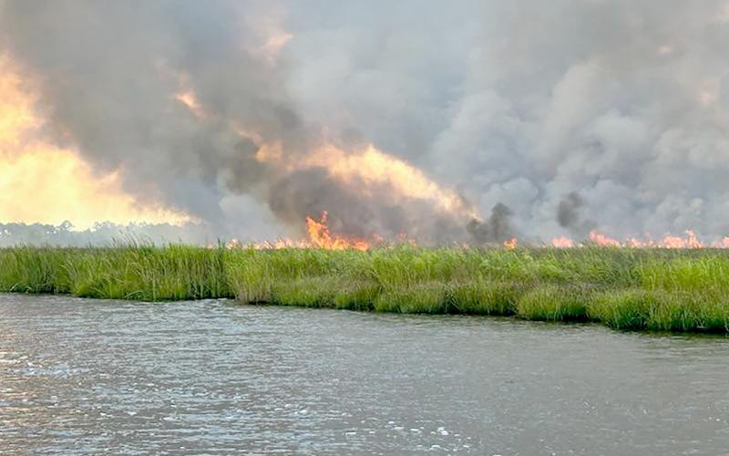 A lightning strike caused a wildfire near the Nassau River Aug. 13. The fire was 100% controlled by Friday morning. A second fire occurred in Bryceville Thursday and its cause is still under investigation. It burned an acre of private property and reportedly did not cause any major damage. Photo courtesy of the Nassau County Sheriff’s Office