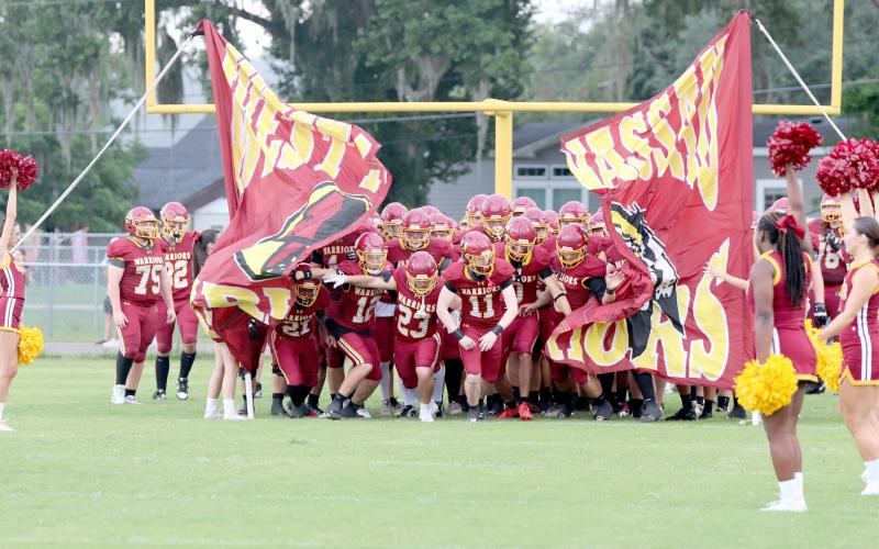The West Nassau Warrior's run out at the start of the game Aug. 15