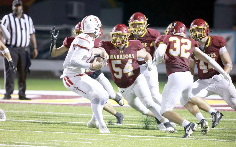 Friday night the Warriors defeat the Trojans 70-30.