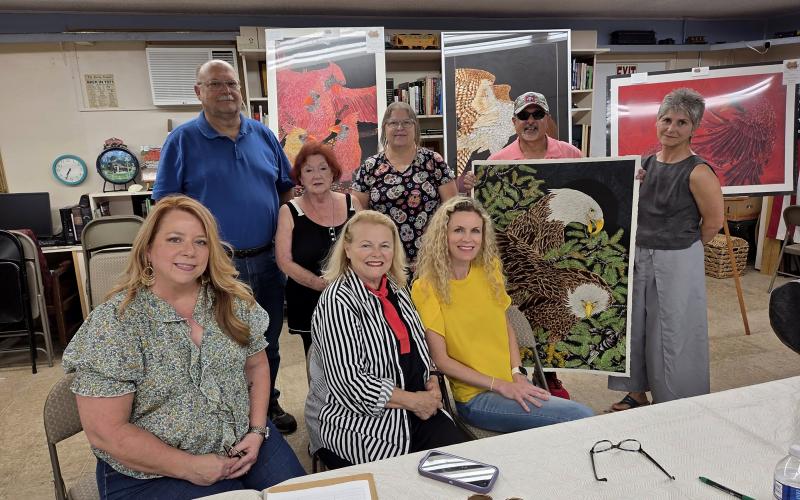 West Nassau Art Alliance co-chair Brenda Schwend, John Hendricks, co-chair Janie Sheehan, Linda Carr, Michelle Swank, Pam Jones, guest artist Walter Cartategui, and Stephanie Bucci pose together at a recent West Nassau Art Alliance meeting. Community members who are interested in helping to expand western Nassau’s cultural offerings can attend the next meeting Oct. 30 at 6:30 p.m. at the Callahan Train Depot.
