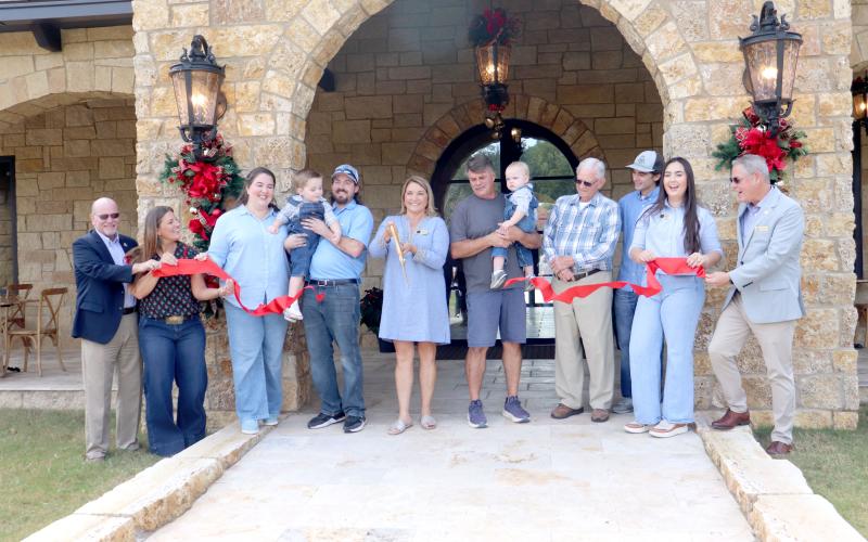 obbie Walker cuts the ribbon to celebrate the official grand opening of The Winery at Tuscan Rose Vineyards Saturday morning. She is joined by family members and Nassau County commissioners Alyson McCullough, John Martin and A.M. “Hupp” Huppmann. The winery is located at 45884 Bismark Road and includes a tasting room, outside seating, and a gift shop with various jams, jellies and other items. Weekend specials were served, including burrata and caprese salads, woodfired pizzas and more. Live music for the g