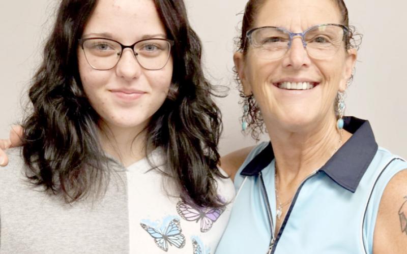 Vicki Arpin mentors Emma Jones at Hilliard Middle-Senior High School. Seventh, eighth and ninth-grade students are encouraged to apply for the program by Nov. 15. Submitted