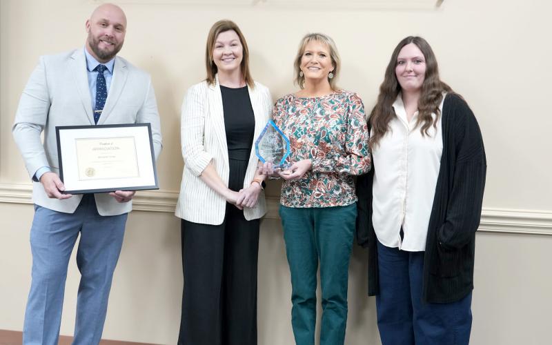 County Manager Taco Pope joins Youth Librarian Michelle Forde, Branch Librarian Amber Ard, and Direct- or of Strategic Advancement Brandy Carvalho above. Submitted