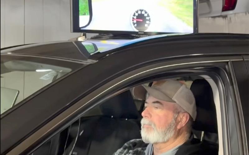 Mike Weiscopf demonstrates the new simulator that allows participants to see how drugs and alcohol impair their driving. Submitted