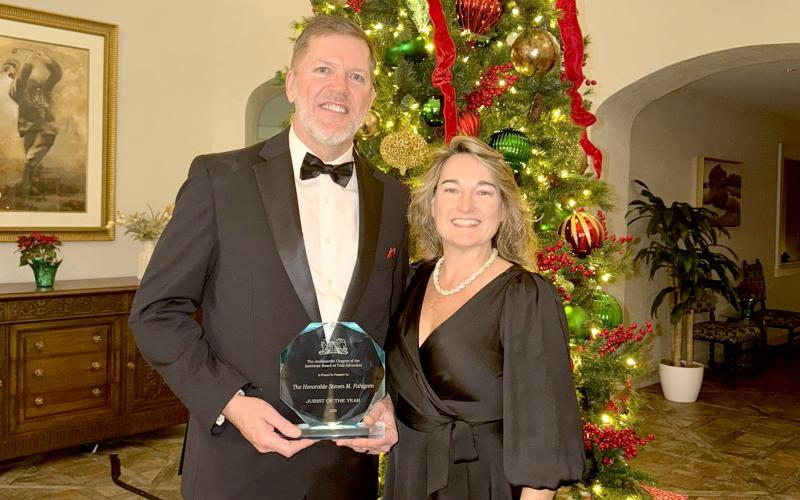 Judge Steve Fahlgren displays his Jurist of the Year award. It was presented by the Jacksonville Chapter of the American Board of Trial Advocates.