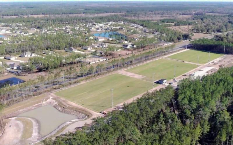 Pictured above are the airnasium (open-air-gymnasium), the outfitter and restroom building, a birthday pavilion, and the amphitheater pad of the new Westside Regional Park. The first phase of the park should open by early summer. Three new FIFA regulation-size soccer fields recently received sod and are pictured below. Photos courtesy of Nassau County officials