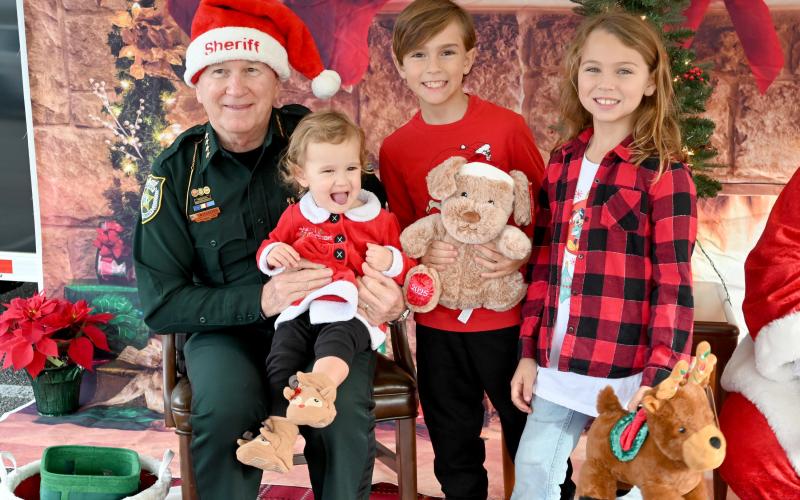 Children meet Santa, Mrs. Claus and Sheriff Bill Leeper in Yulee Dec. 17  during the Santa with a Badge event. Submitted