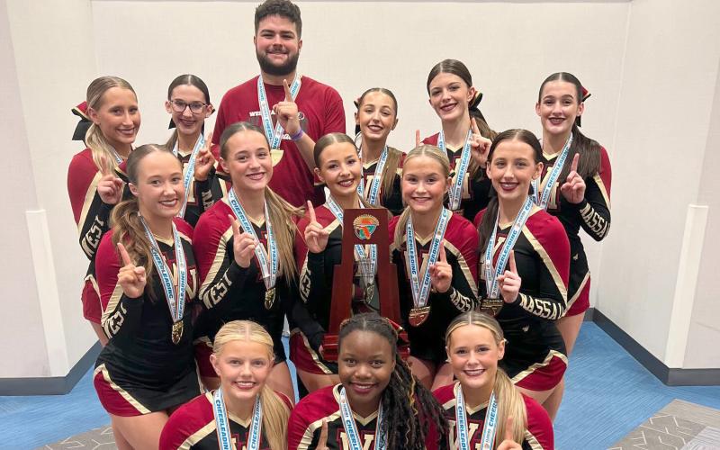 The West Nassau High School cheerleaders celebrate the school’s 15th state championship Jan. 23. The team competes against five other teams within Florida High School Athletic Association Class 1A Medium Non-Tumbling.