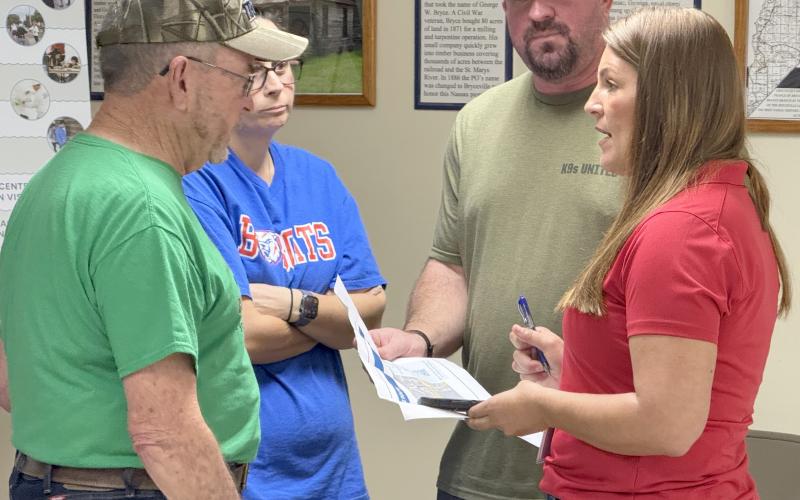Board of Nassau County Commissioners Chair Alyson McCullough speaks with Bryceville resident Rocky Lynn and other concerned  citizens during a community information session Friday at the Bryceville Community Center. Submitted