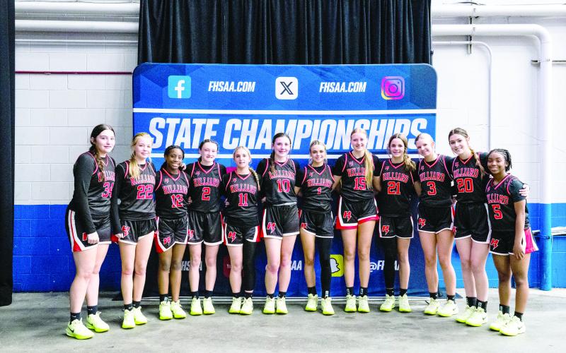 The Lady Flashes group together at the state championships Feb. 26, 2025, where they finished in the Final Four.
