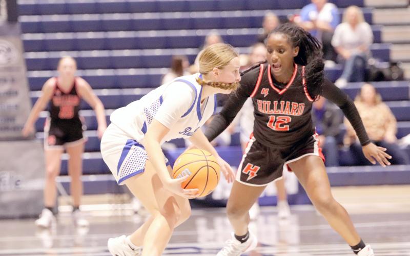 Hilliard eighth-grader Justice Alderman guards a Lady Royal in the Florida High School Athletic Association Rural Class state semifinal game at the University of North Florida Feb. 24. The arena was packed with Hilliard fans.