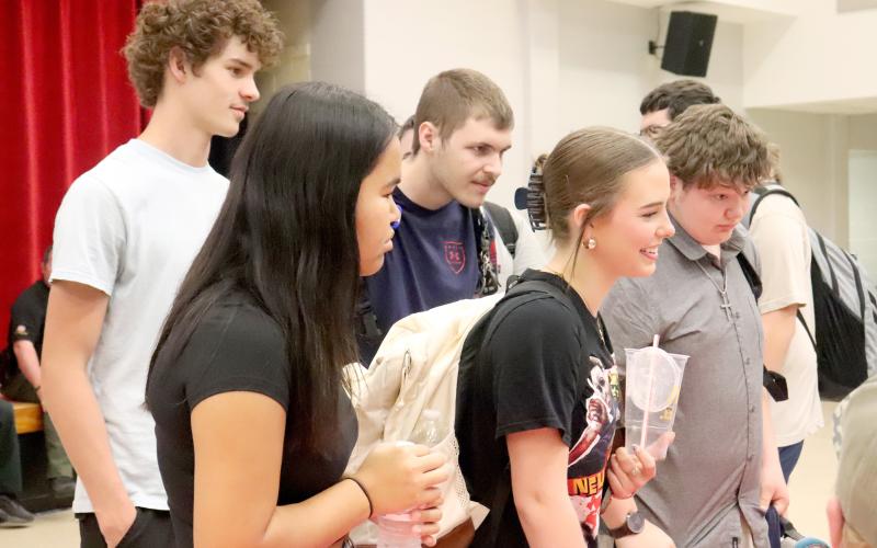 HMSHS students Jayden Kjensino, Paul Nighbert, Madison Hemingway, Alina Roberts, and Andrew Burgess stand together as they learn about different career opportunities.