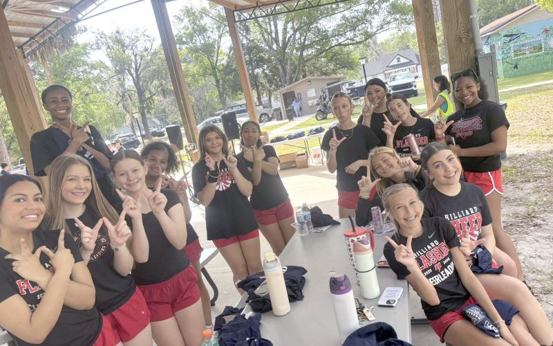 The Hilliard cheerleaders help beautify Hilliard.