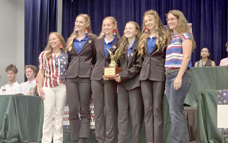 Lily Zettler, Lainey Walters, Amelia Hawkes and Eden Hawkes celebrate the Homeschool team’s victory April 16 at Wildlight Elementary. Submitted