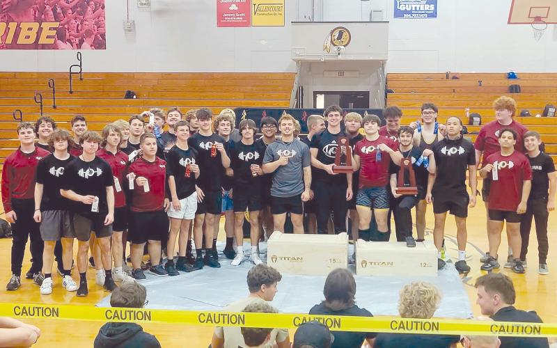 The West Nassau Warrior weightlifting team stand together after winning both Olympic and Traditional Class 1A Region 3 District 5 championships April 7. A total of eight Warriors claimed gold for their weight classes and three Hilliard Middle-Senior High School students claimed gold in both Traditional and Olympic categories.