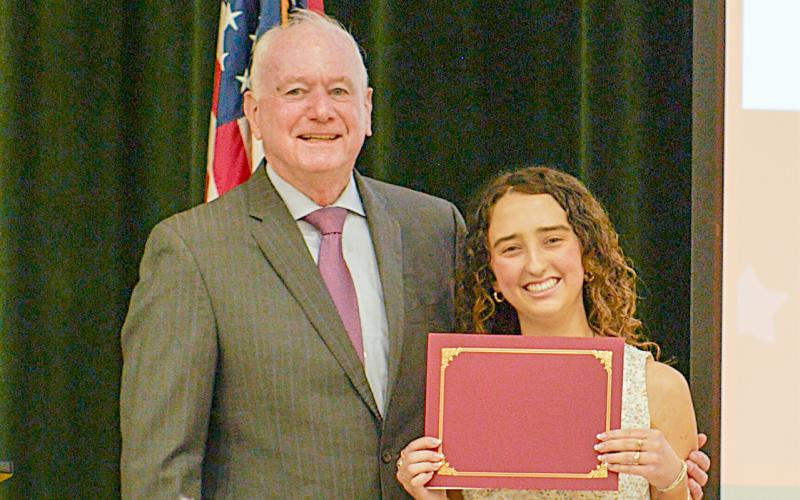 HMSHS senior McKenzie Roberts receives a $10,000 scholarship for writing an award-winning essay.