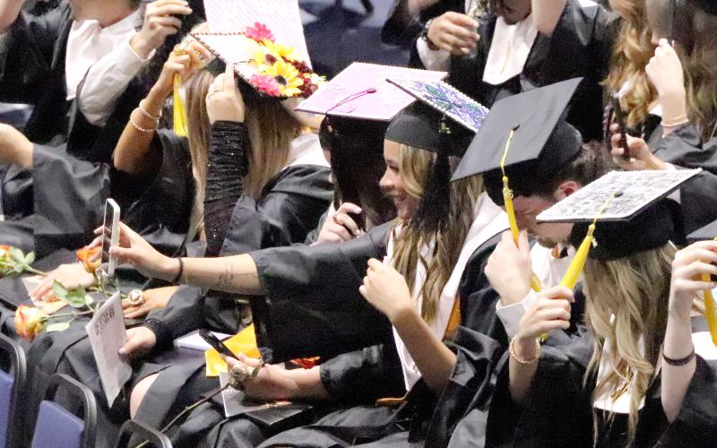 Danyelle Bell records herself as the West Nassau High School Class of 2026 turns tassels during commencement May 20 at the University of North Florida.