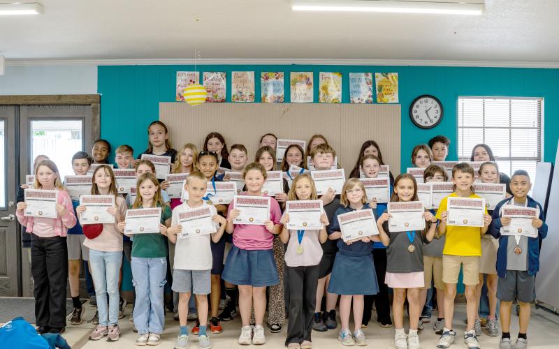 Sonshine Christian Academy third through 12th grade students display certificates from their performances at the League of Christian Schools’ Arts Festival held in Lakeland.