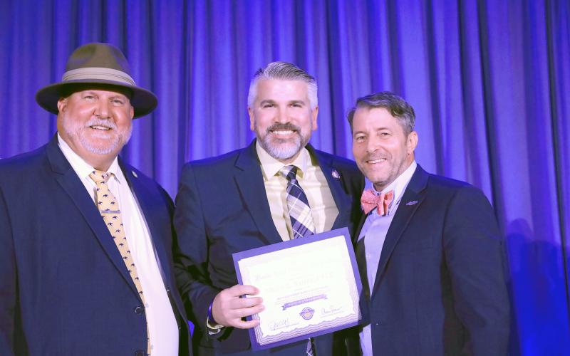 Nassau County Clerk of the Circuit Court and Comptroller Mitch Keiter, center, receives his certificate of completion. Submitted