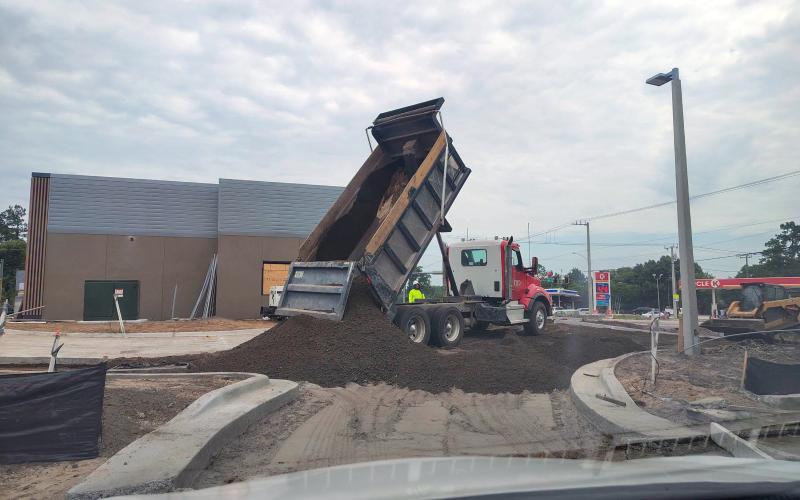 A truckload of dirt is delivered to shape the parking lot at Hilliard’s new McDonald’s. Triple B Dirt LLC hauled 65 loads of dirt then topped it with 40 loads of crushcrete road base to help form the parking lot. Photo courtesy of Triple B Dirt, LLC
