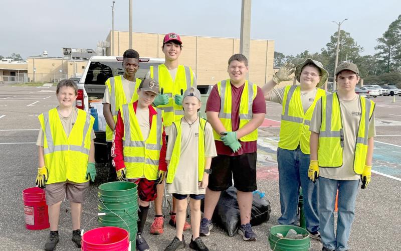Callahan Boy Scout Troop 351 braves the heat  Saturday to keep Callahan’s Warrior Drive and Brown Street litter free. The troop is an Adopt-a-Highway partner for Keep Nassau Beautiful, Inc. Submitted