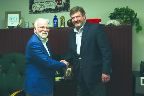 Foy Maloy, left, with Community Newspapers, Inc. Chairman Alan NeSmith, shared the news that Maloy is retiring. He serves as the Coastal Region publisher, retiring in January. Photo by Ashley Chandler