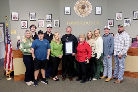 Hilliard Town Council President Kenny Sims receives a resolution recognizing his 20 years as a public servant. 